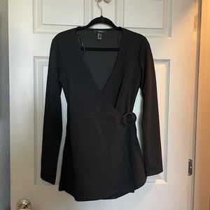 Black Forever 21 long sleeved romper from Forever 21. Size Large